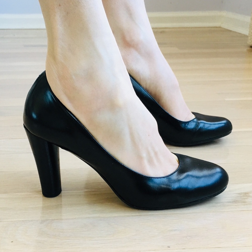 Black leather pumps